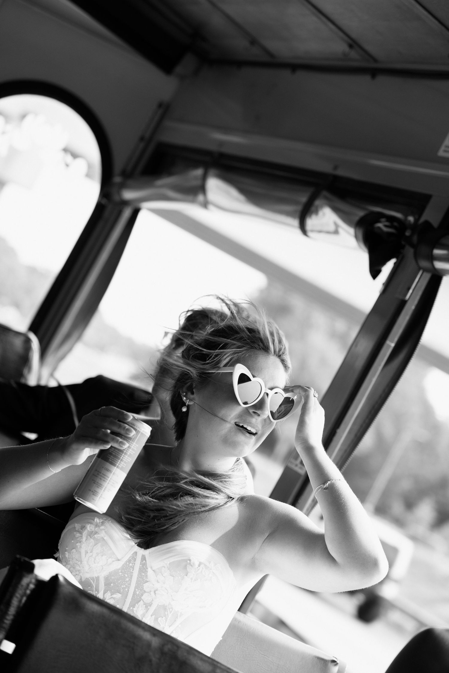 A series of black and white photos showing the bride in heart-shaped sunglasses in a car.