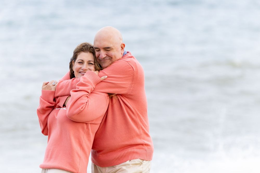 Parents are captured embracing at Low Beach on Nantucket, MA (Sconset) by Lisa West Photography www.lisawestphotography.com