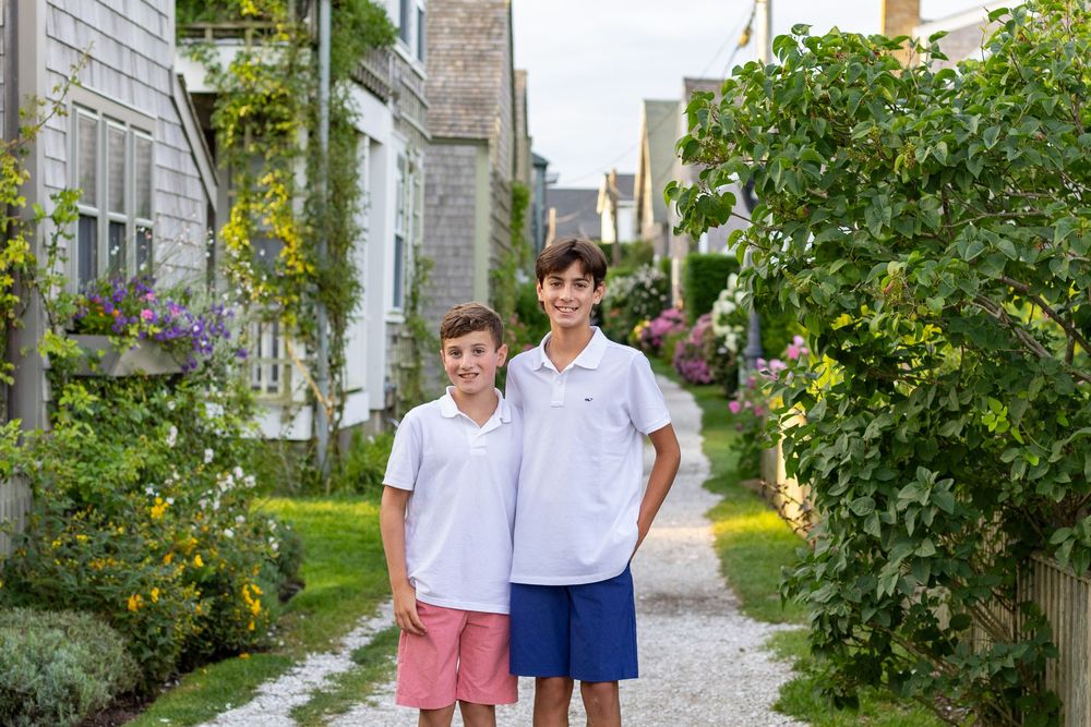 Two brothers pose together along Front St in Sconset on Nantucket, MA Lisa West Photography www.lisawestphotography.com