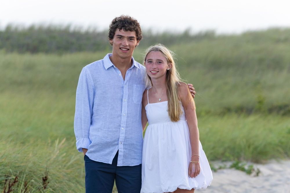 Siblings pose at dusk at Miacomet Beach on Nantucket, MA by Lisa West Photography www.lisawestphotography.com