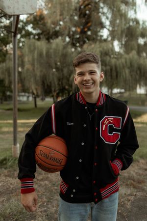 A series of photos showing a student athlete in a varsity letterman jacket holding a basketball outdoors.