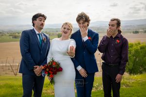 groomsmen swooning over bride's ring