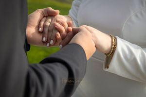 couple holding hands closeup