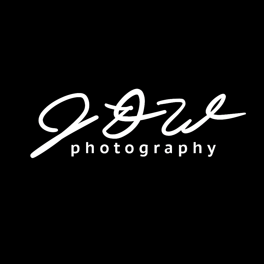 Black calligraphic signature or artistic handwriting design on dark background.