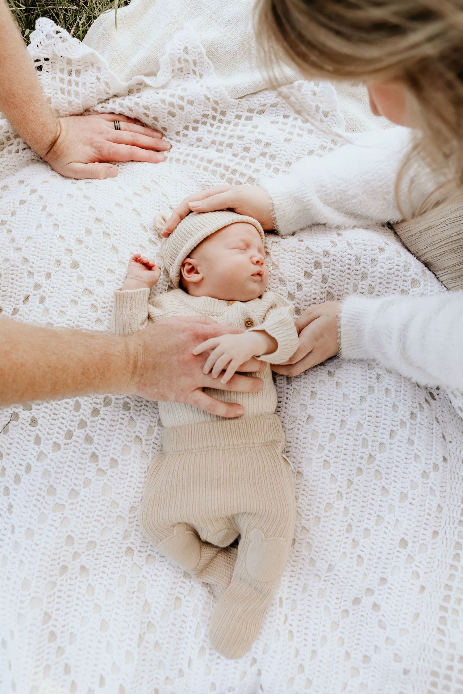 Mum dad and baby enjoying a moment together during a family session