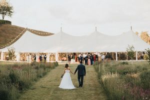 A row of outdoor wedding photos showing a tent reception, rustic settings, and wildflower fields at golden hour.