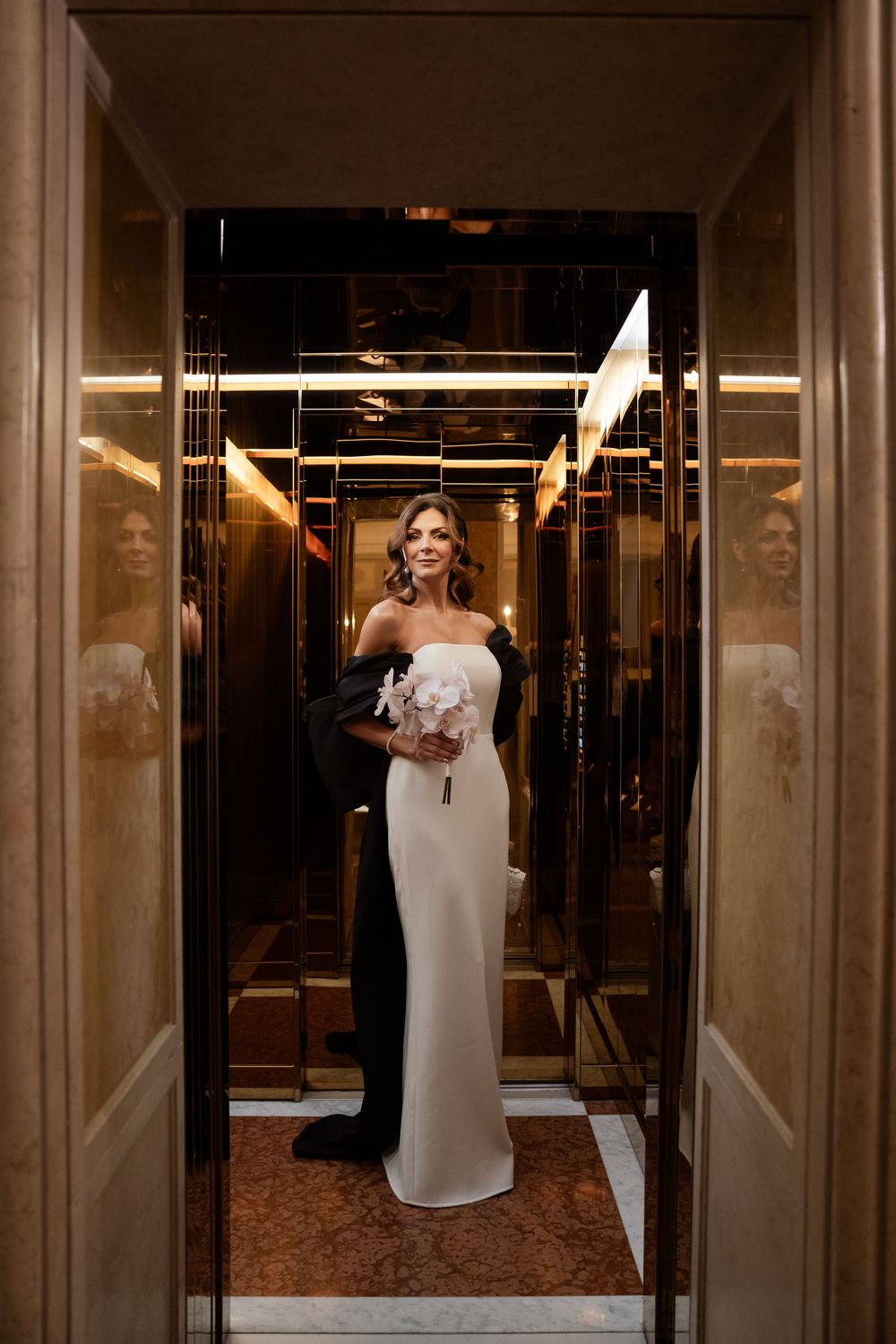 Dramatic black and white shots of elegant hotel corridor with reflective surfaces. Photoshoot by Venice Photographer Alina Indi
