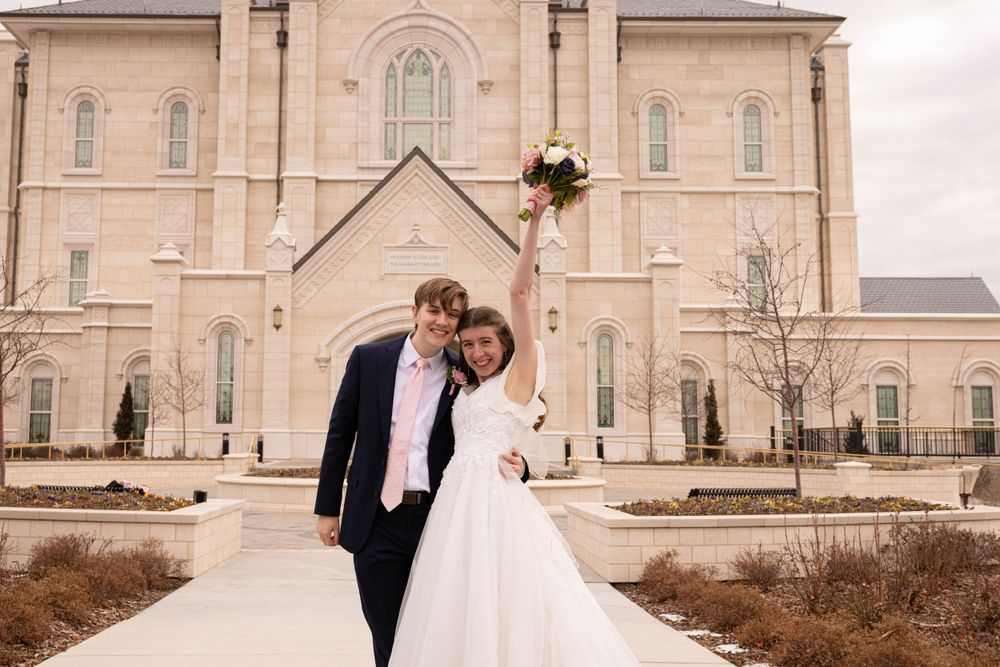 Couple celebrating after temple wedding.