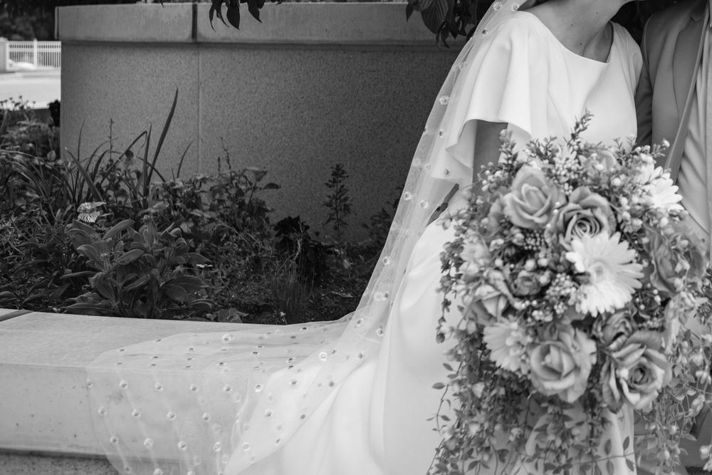 Black and white detail shot of bride's veil/bouquet.
