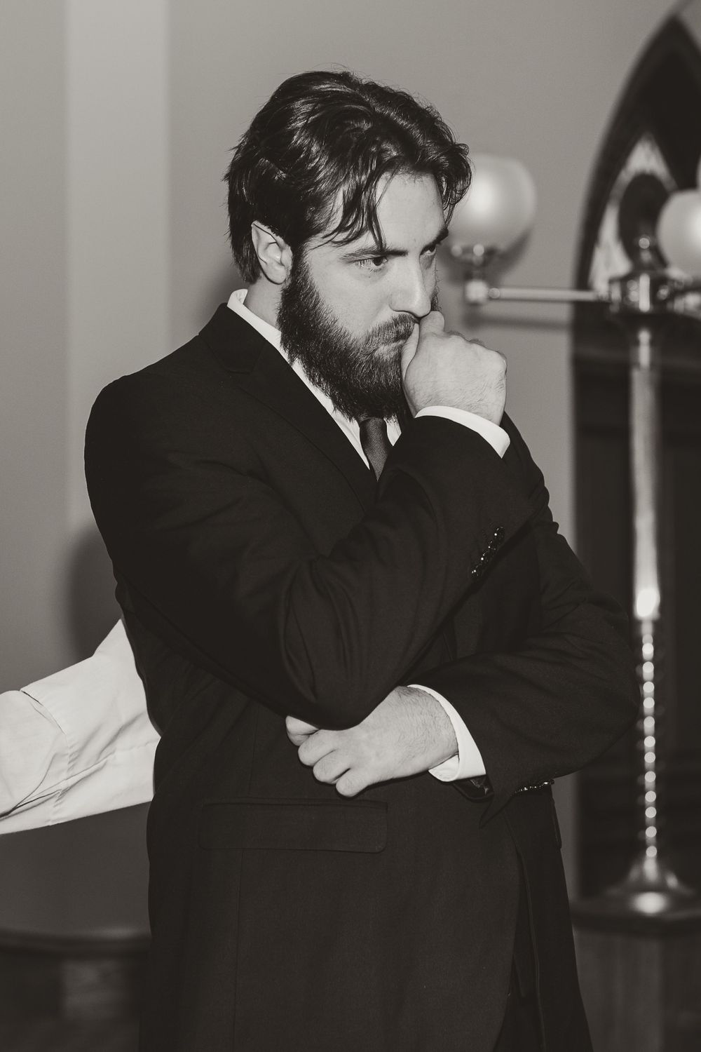Emotional moment captured in black and white during wedding ceremony.