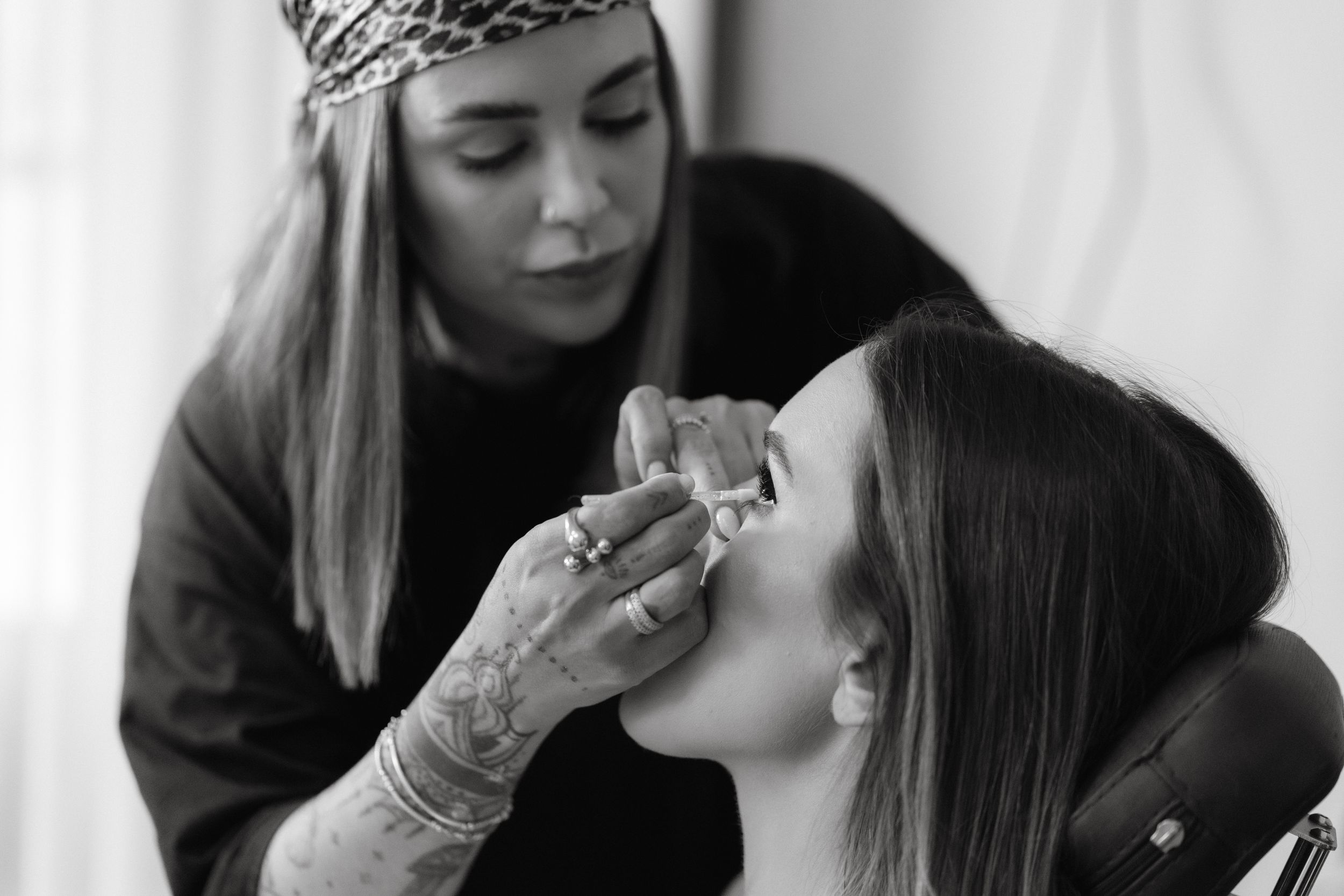 Intimate monochrome photography session in a minimalist setting.