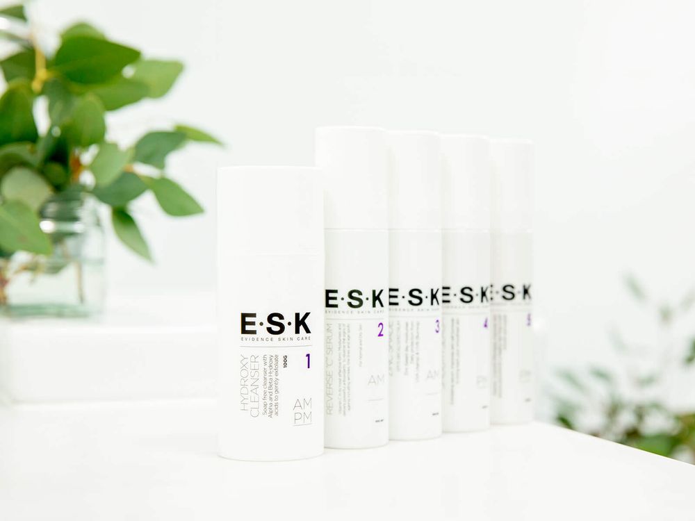 ESK product shot in  bathroom with greenery in the background