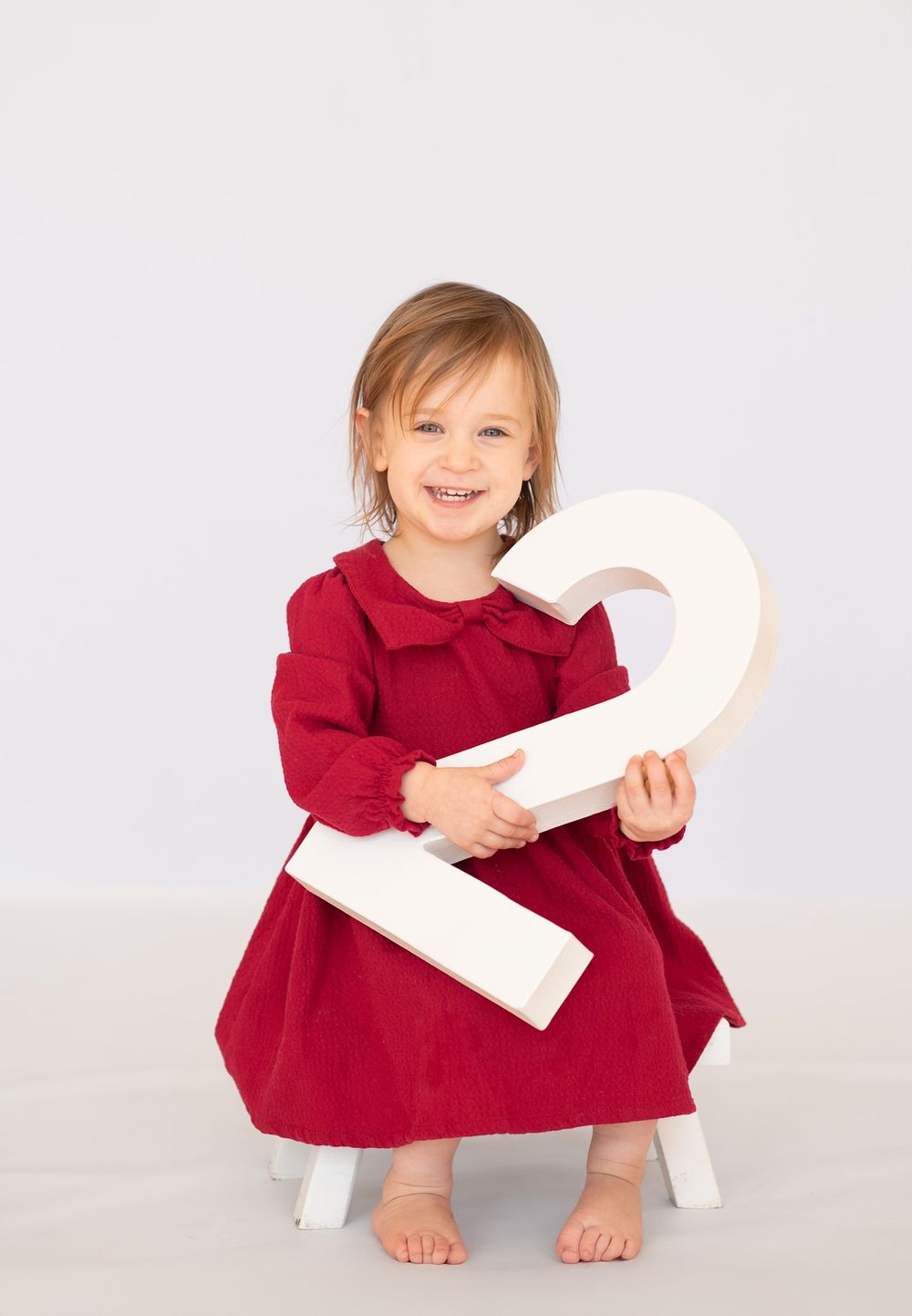 2 year old girl toddler milestone birthday session at natural light studio by Bartlesville Photographer Kristi Bray