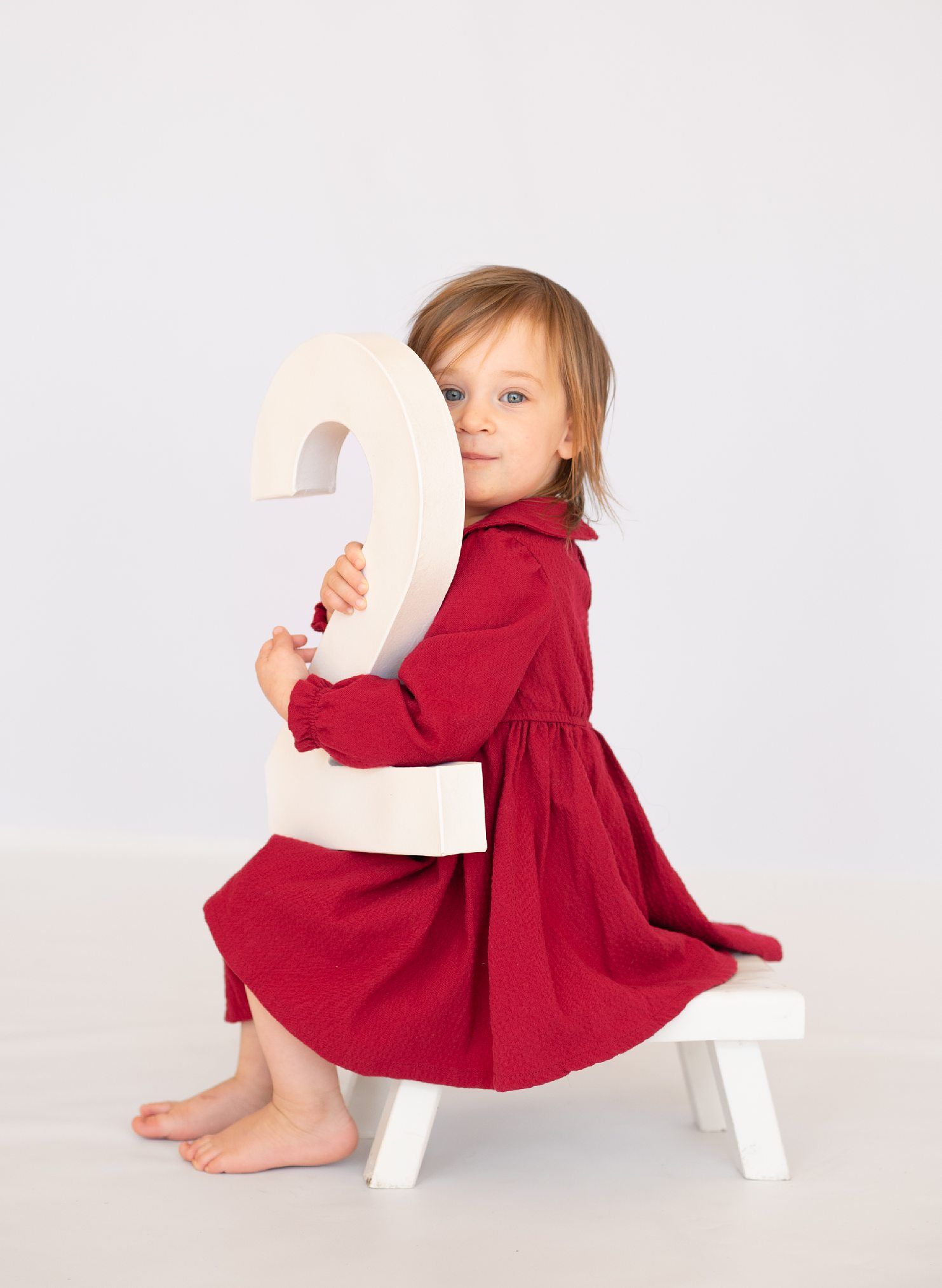 2 year old girl toddler milestone birthday session at natural light studio by Bartlesville Photographer Kristi Bray