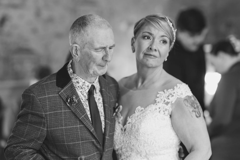 Black and white portrait of wedding guests during an outdoor celebration.