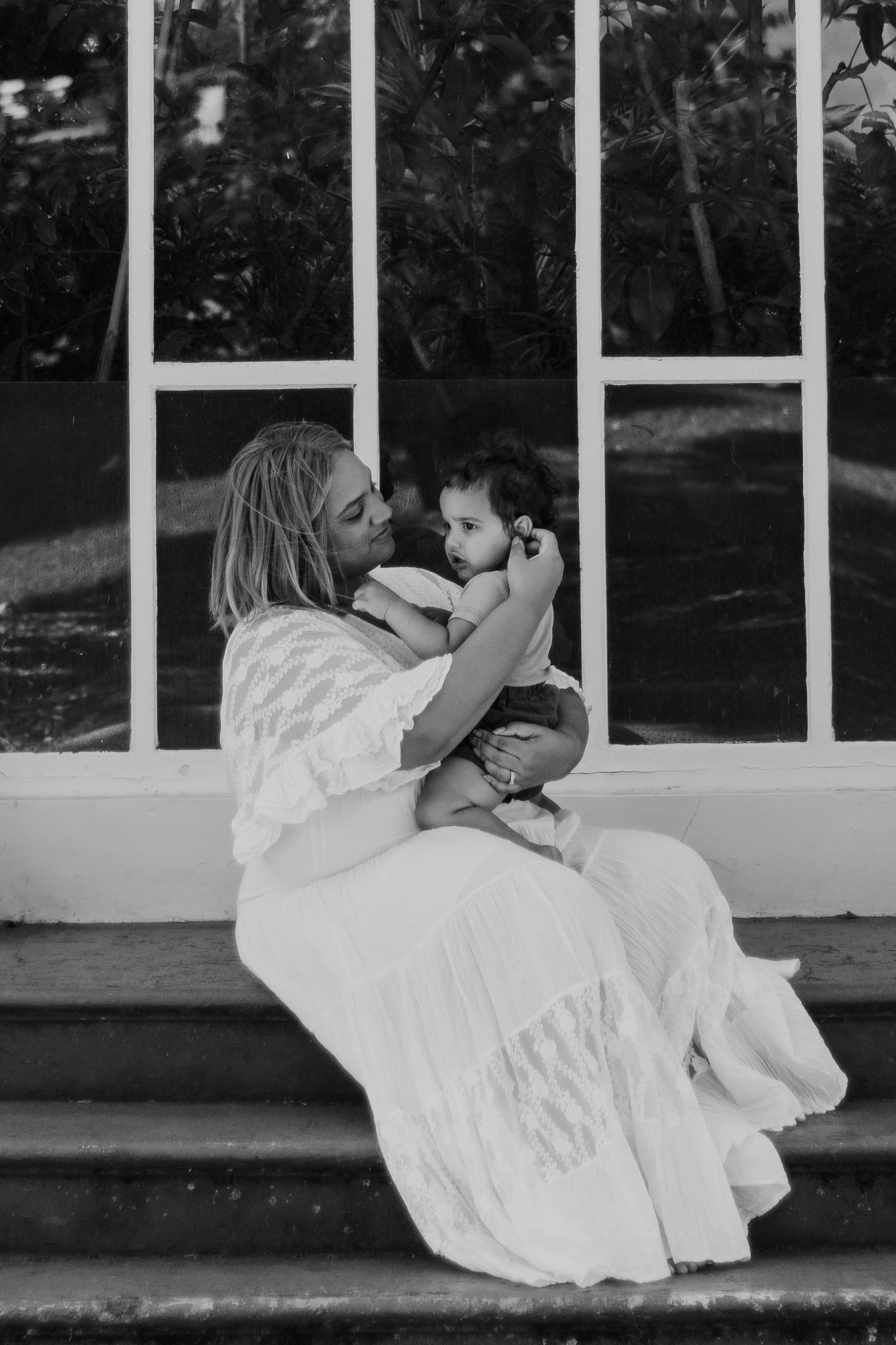 Photo of a mother and her baby boy smiling together at a Launceston park