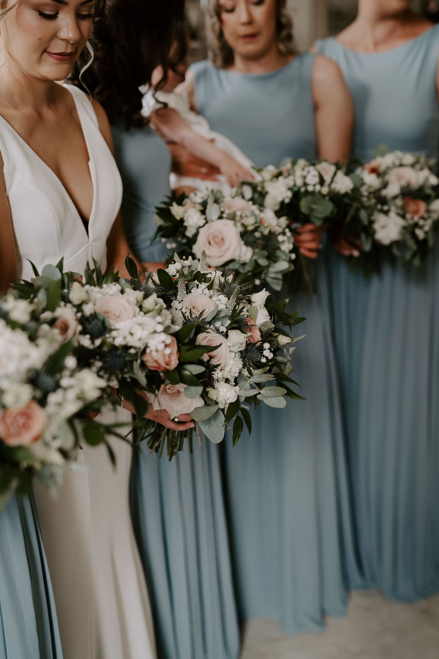bride and bridesmaids bouquets at Iscoyd park