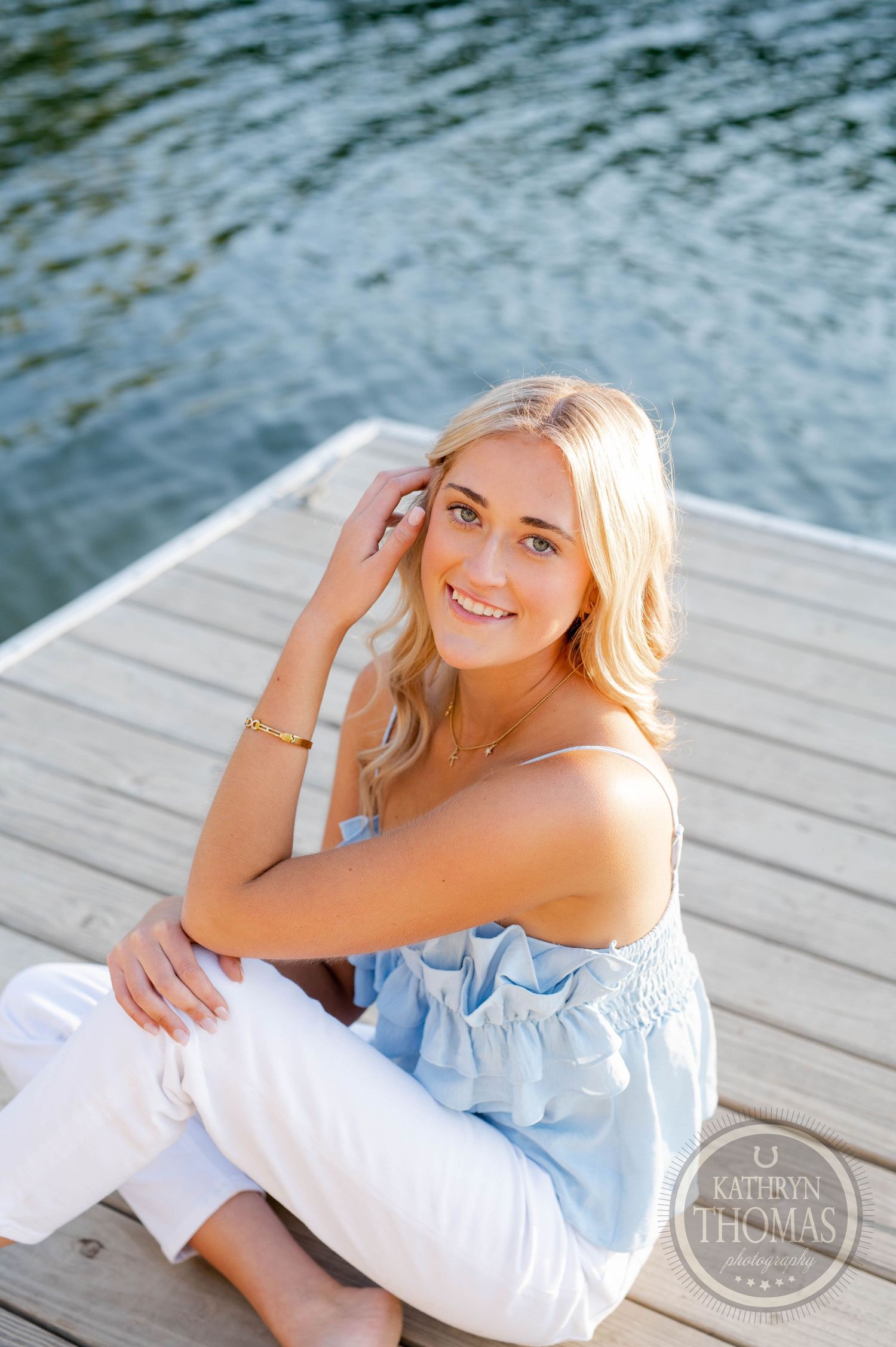 Waterfront portrait featuring casual summer style and natural lighting.