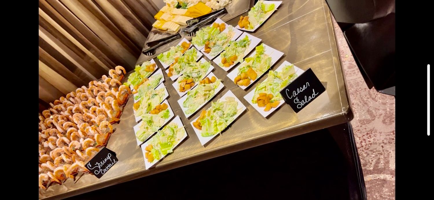 Assorted yellow snack packages arranged on a wooden cutting board.