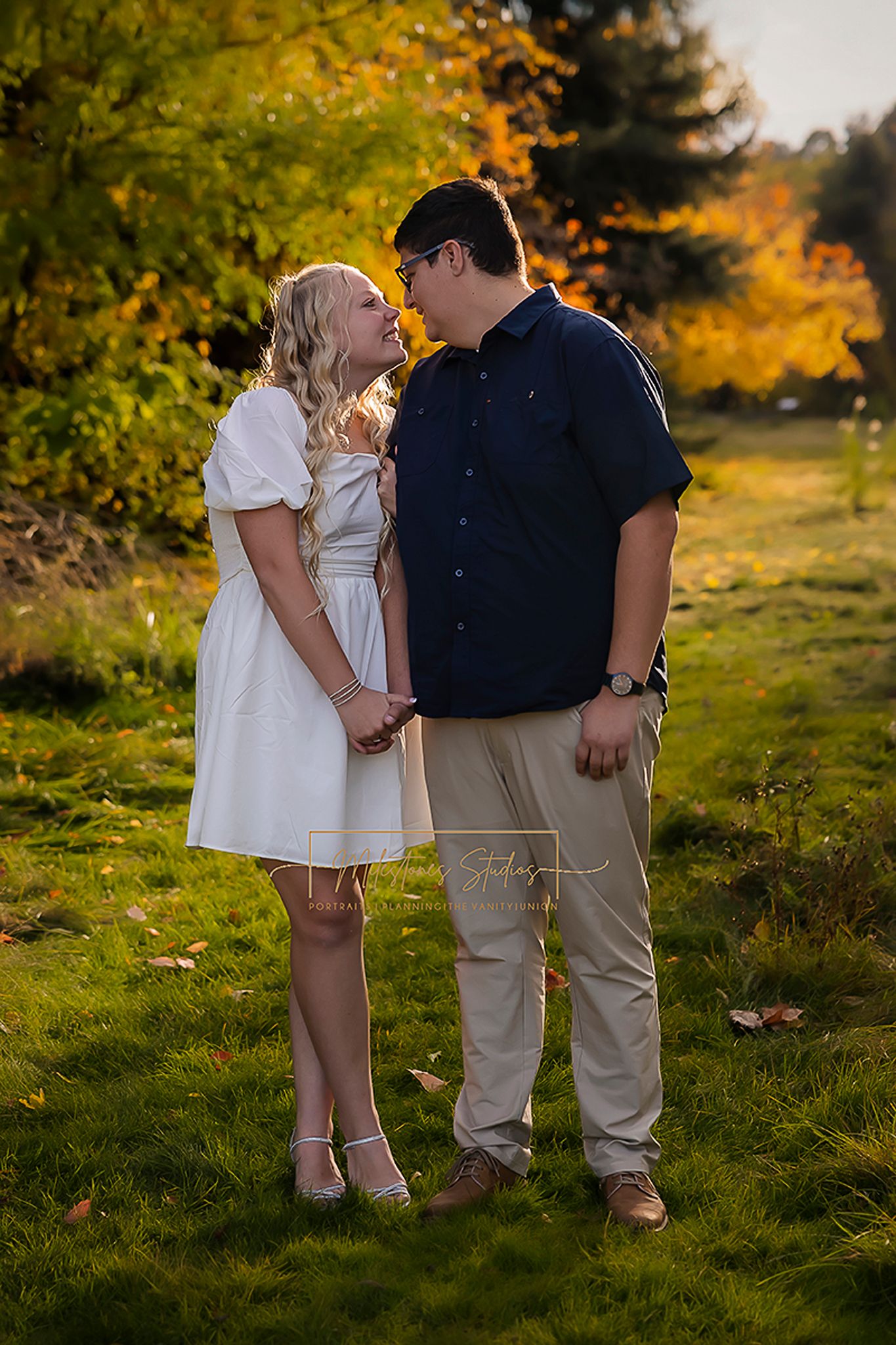 Boise engagement photo of couple looking at each other at Kathryn Albertson Park