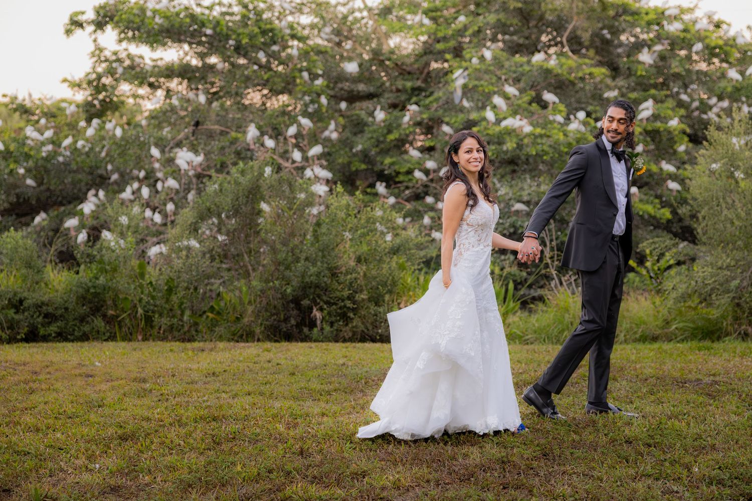 Bride and groom holding hands at Long Key Natural Area & Nature Center