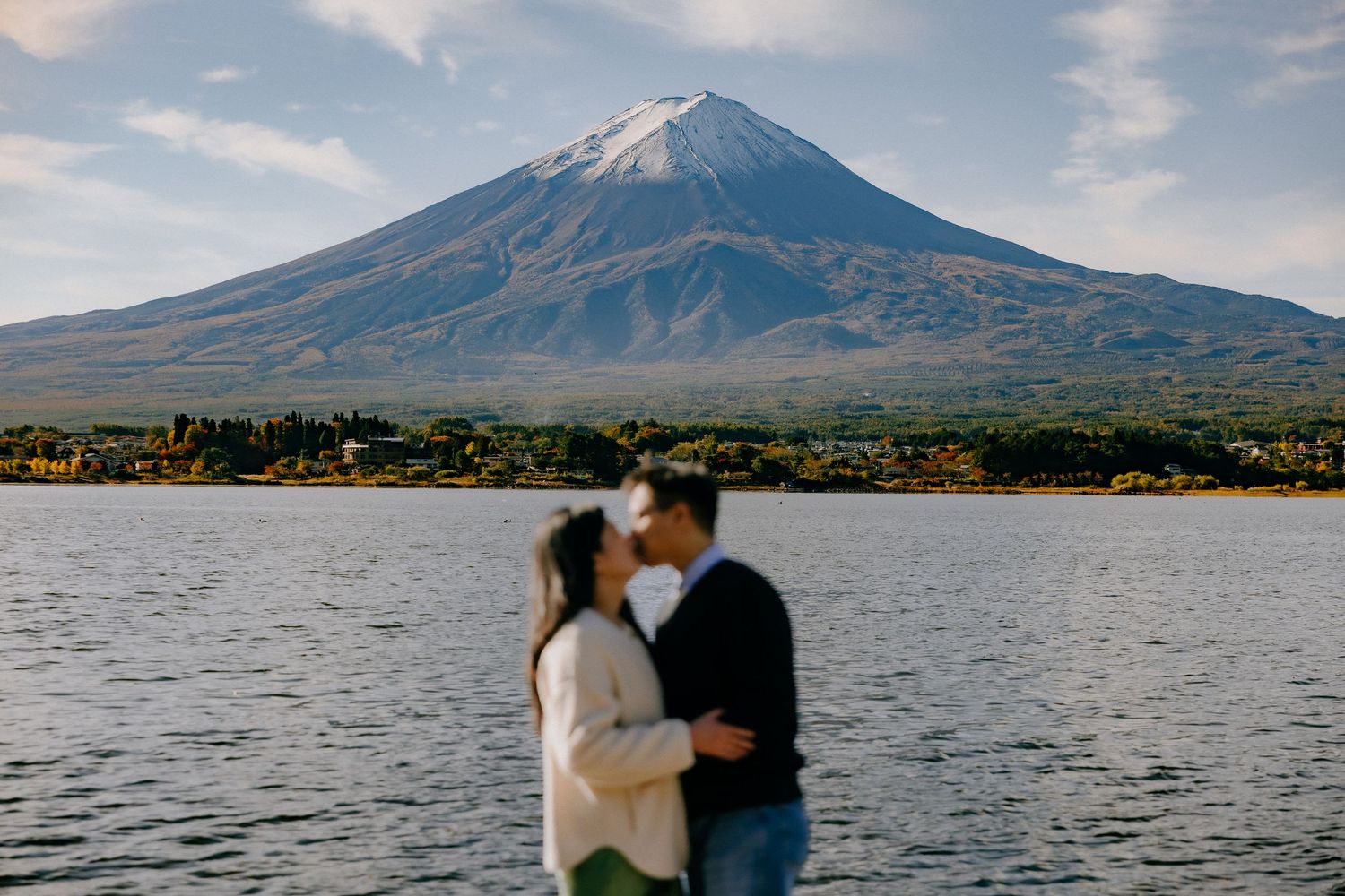 Mount Fuji rises majestically in the background of Lake Kawaguchiko during a scenic sunset in Japan.