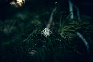 Park City Utah Elopement photography in the mountains. Dramatic moody Ring shot. Creative posing and wedding photos on Halloween night