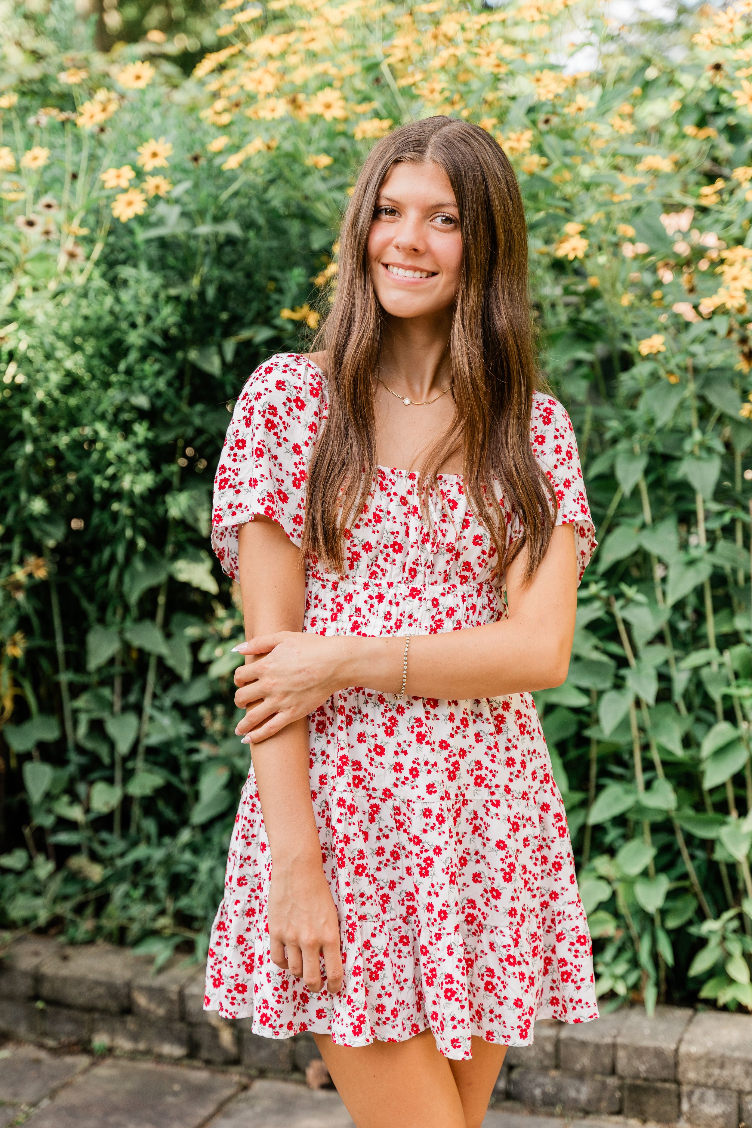 A series of outdoor portrait photos showing someone in a red and white floral patterned top against a garden background.