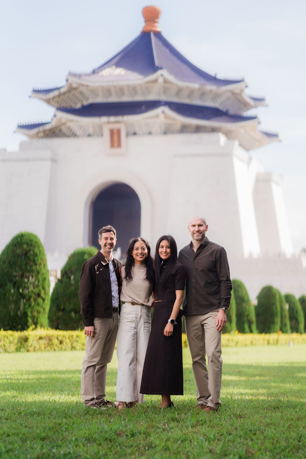 A group stands in front of the iconic Chiang Kai-shek Memorial Hall in Taipei, Taiwan.