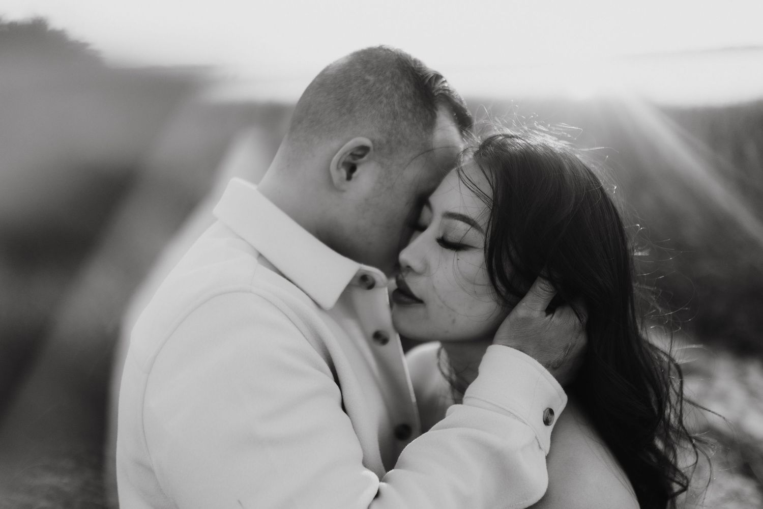 Black and white romantic images showing tender kisses and intimate moments between couples in love.