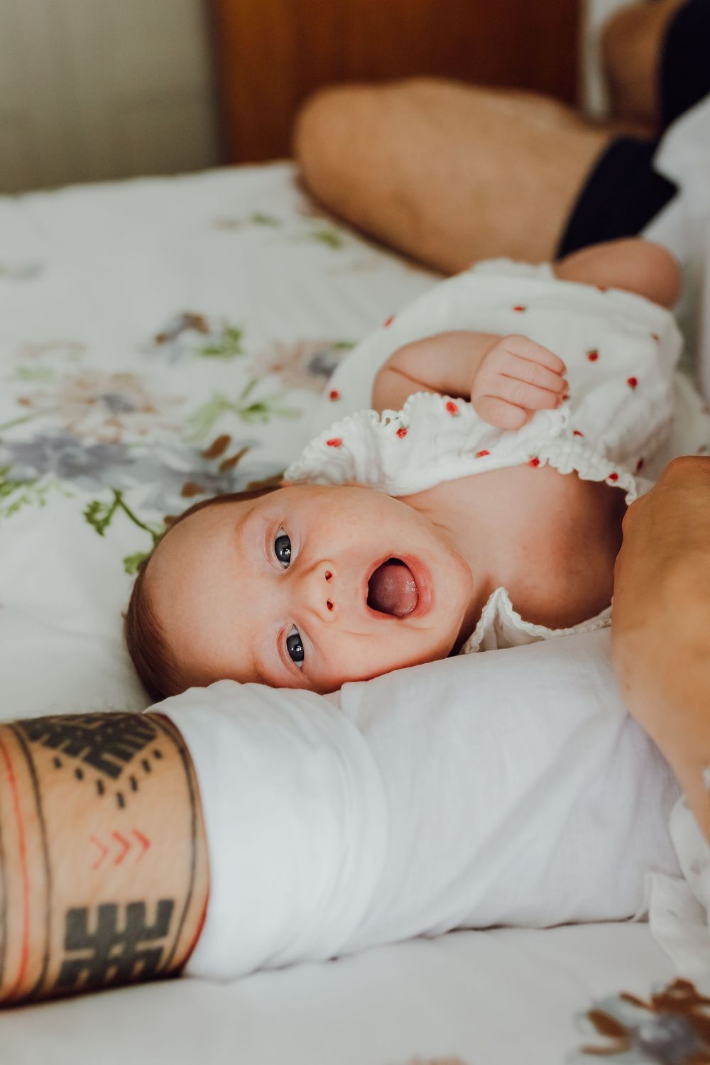 Tender newborn moments captured at home in a calm and cosy environment