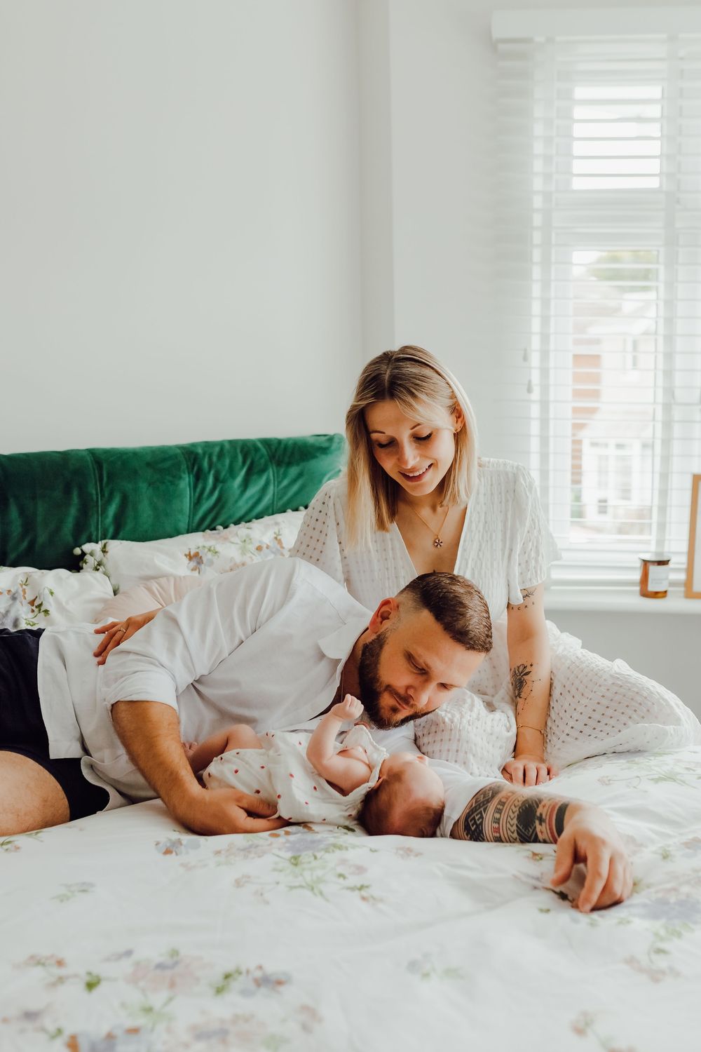 Newborn baby sleeping peacefully during a cosy lifestyle session at home