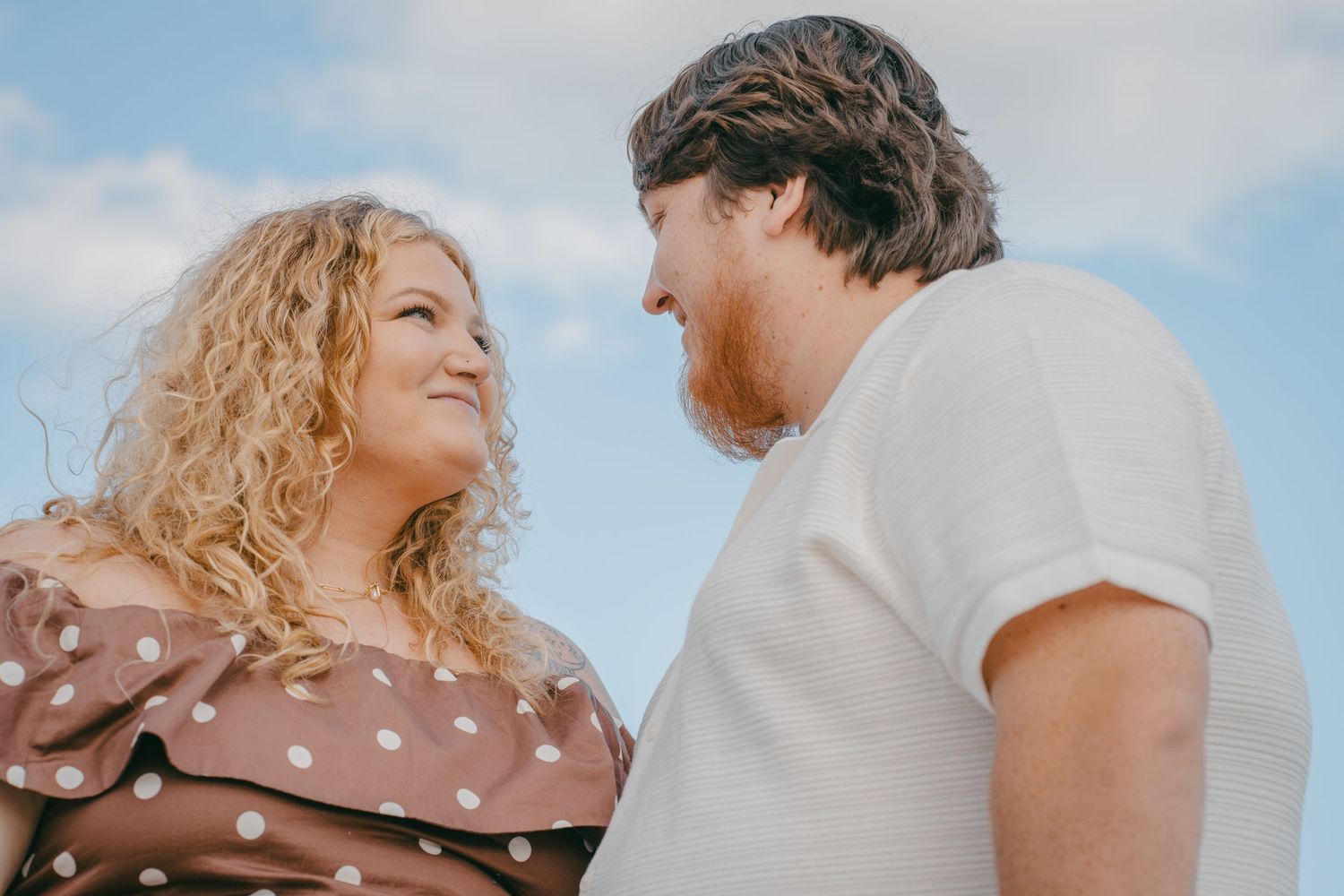 A romantic beach scene with soft lighting and blurred bokeh effects.