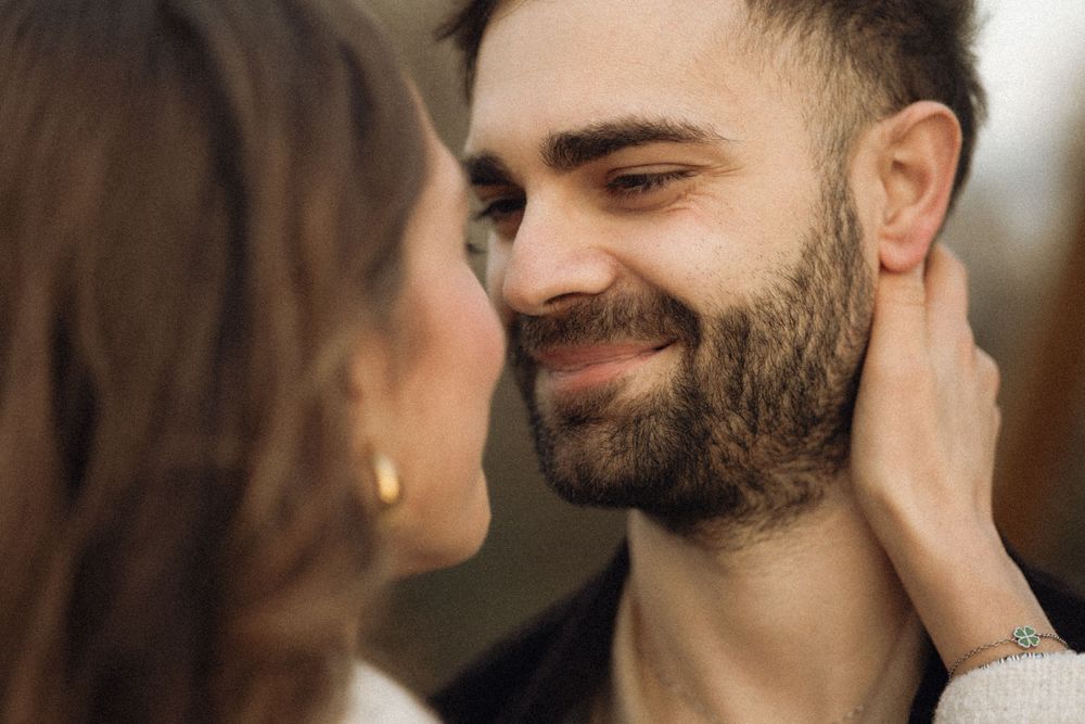 A series of intimate close-up shots showing tender romantic moments between a couple.