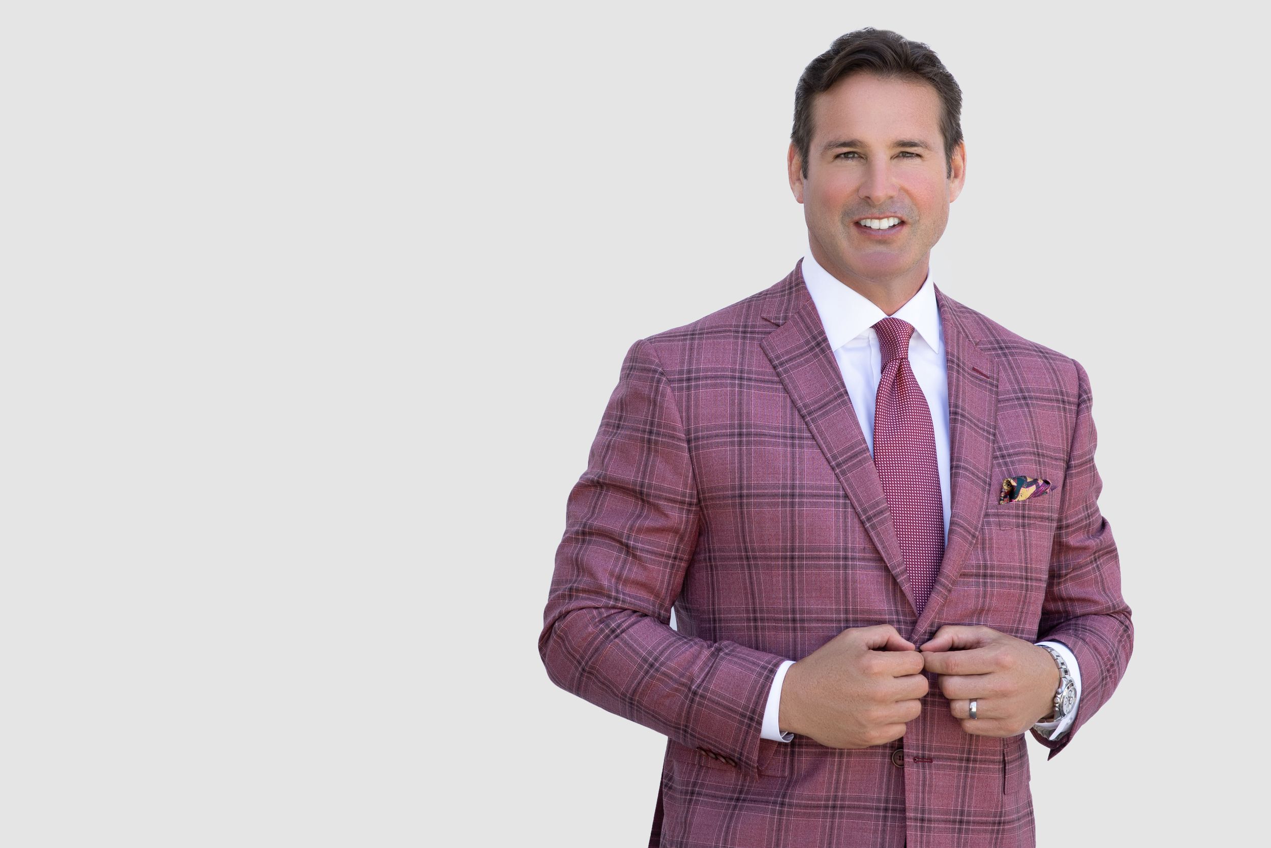 Male realtor professional portrait, sharp suit and approachable expression