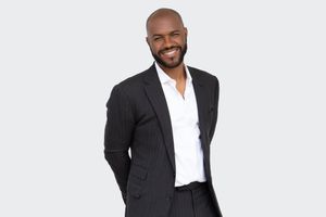 Male realtor professional portrait, sharp suit and approachable expression