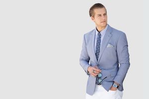Male realtor professional portrait, sharp suit and approachable expression