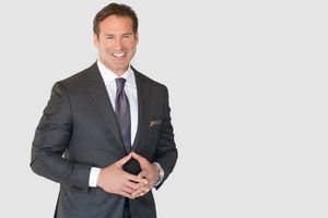 Empowering headshot of a realtor, showcasing trust and expertise