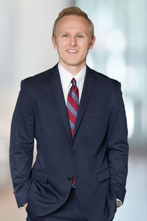 Male realtor professional portrait, sharp suit and approachable expression