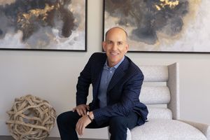 Individual corporate headshot for real estate branding, high-quality studio shot