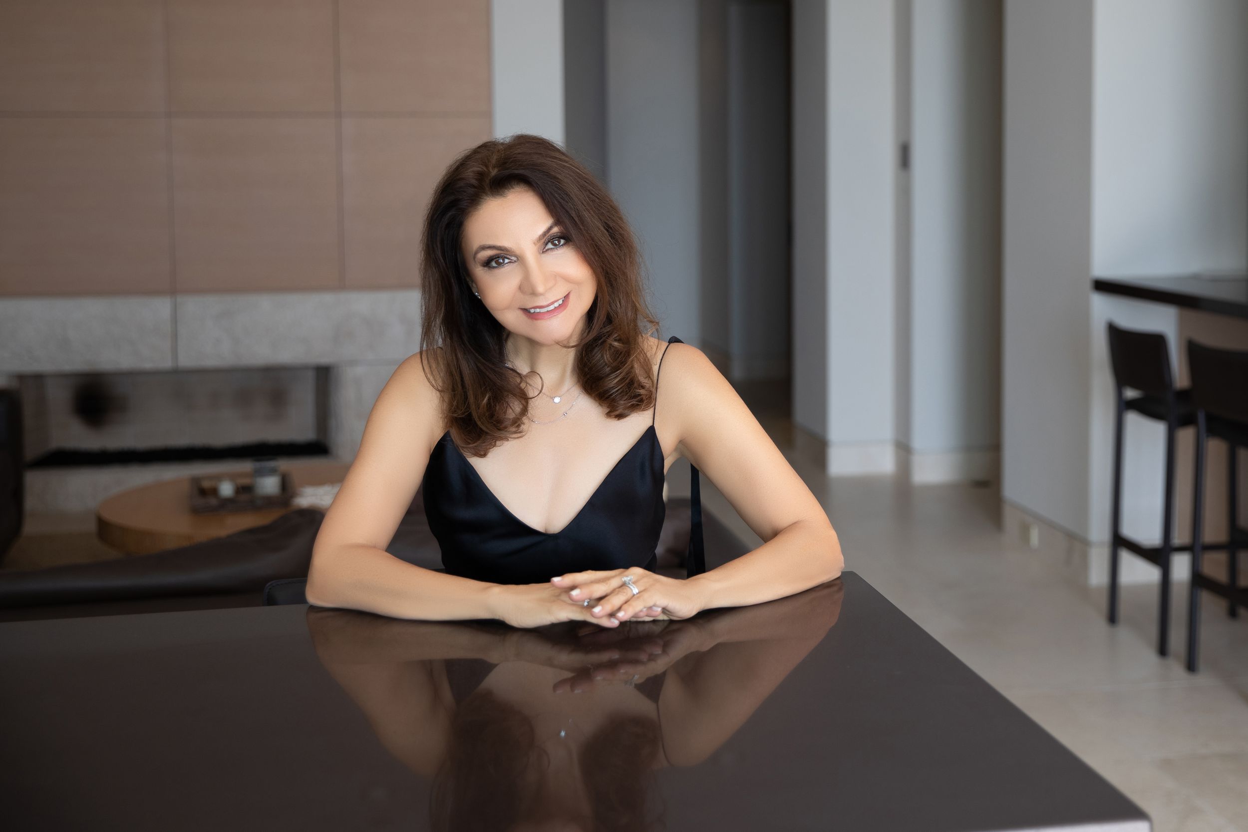 Professional portrait of a real estate agent in modern office setting
