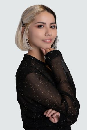 Professional real estate agent headshot, confident pose in business casual