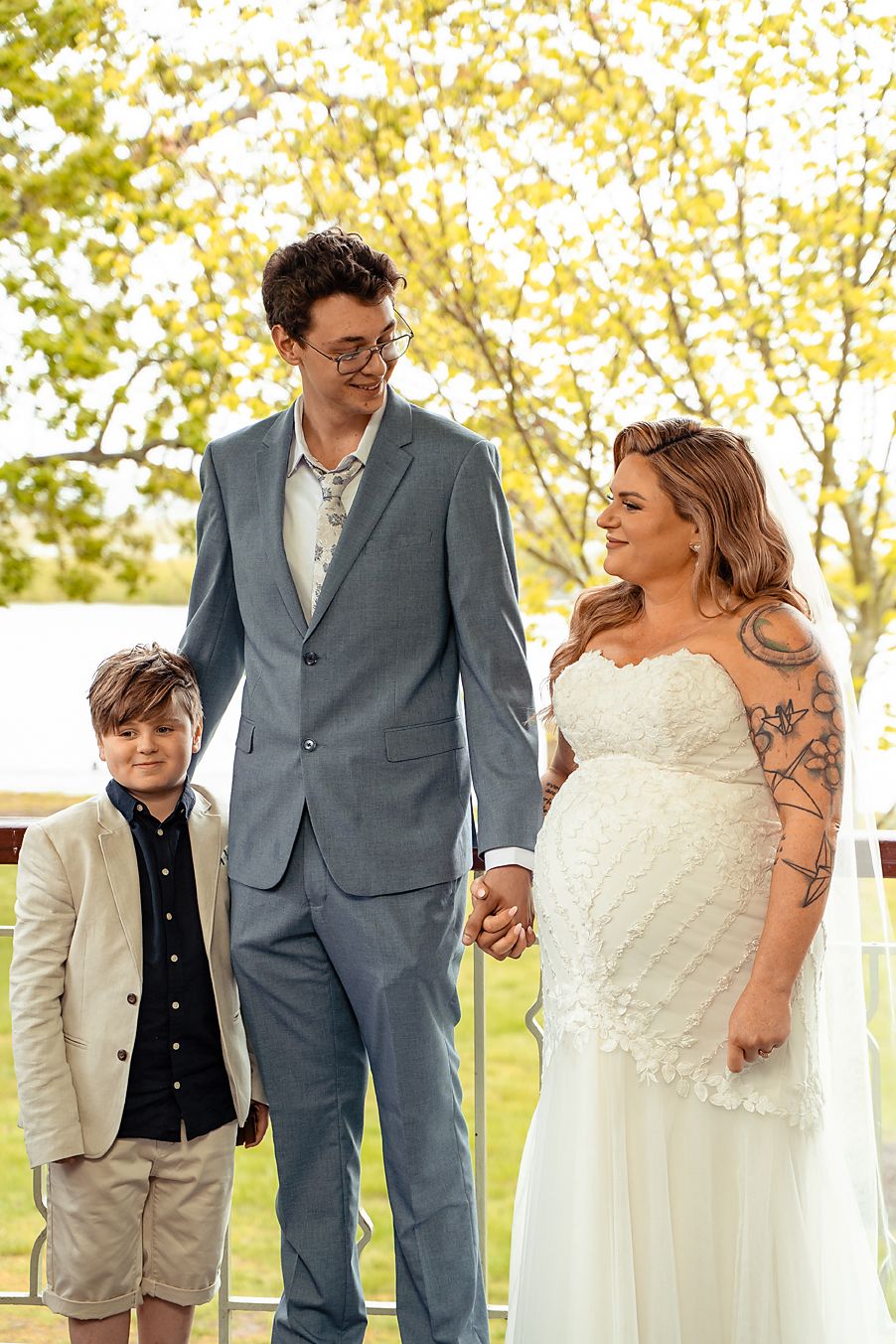 A newlywed couple shares candid moments in a series of outdoor wedding photos with natural lighting.