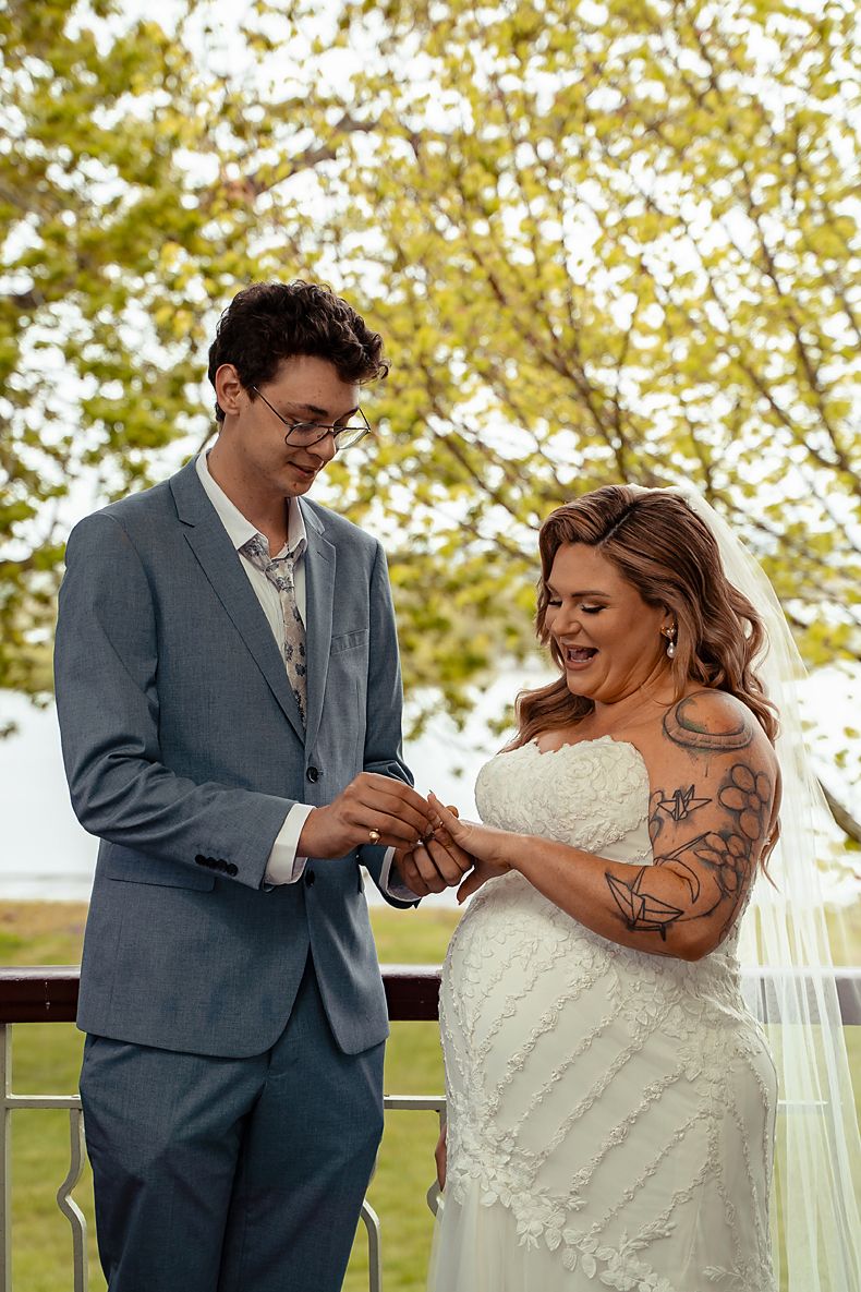 A romantic outdoor wedding moment captured in a series of photos showing a couple dancing together under autumn trees.
