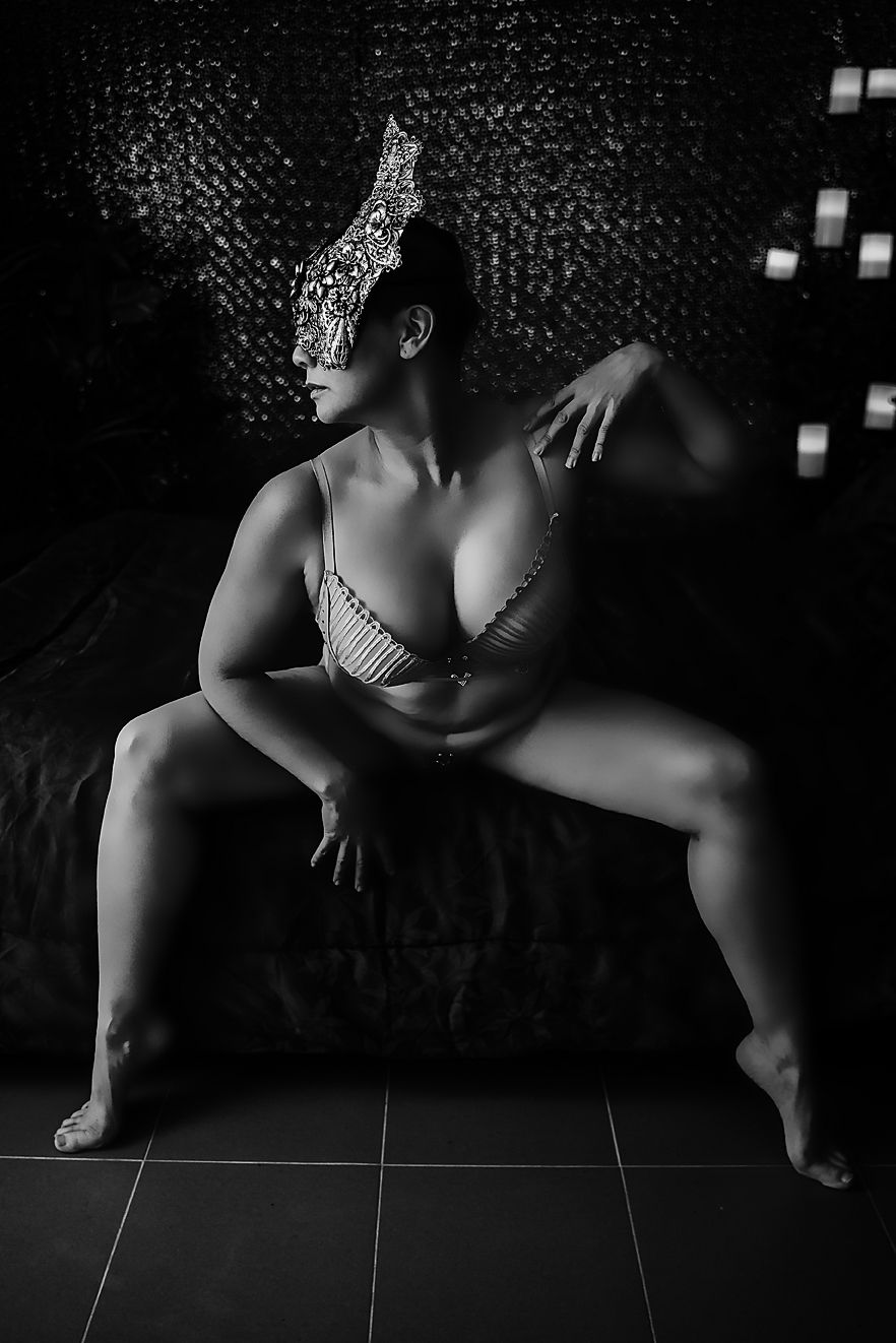 Low angle black and white photography series showing silhouetted figure against dark background.