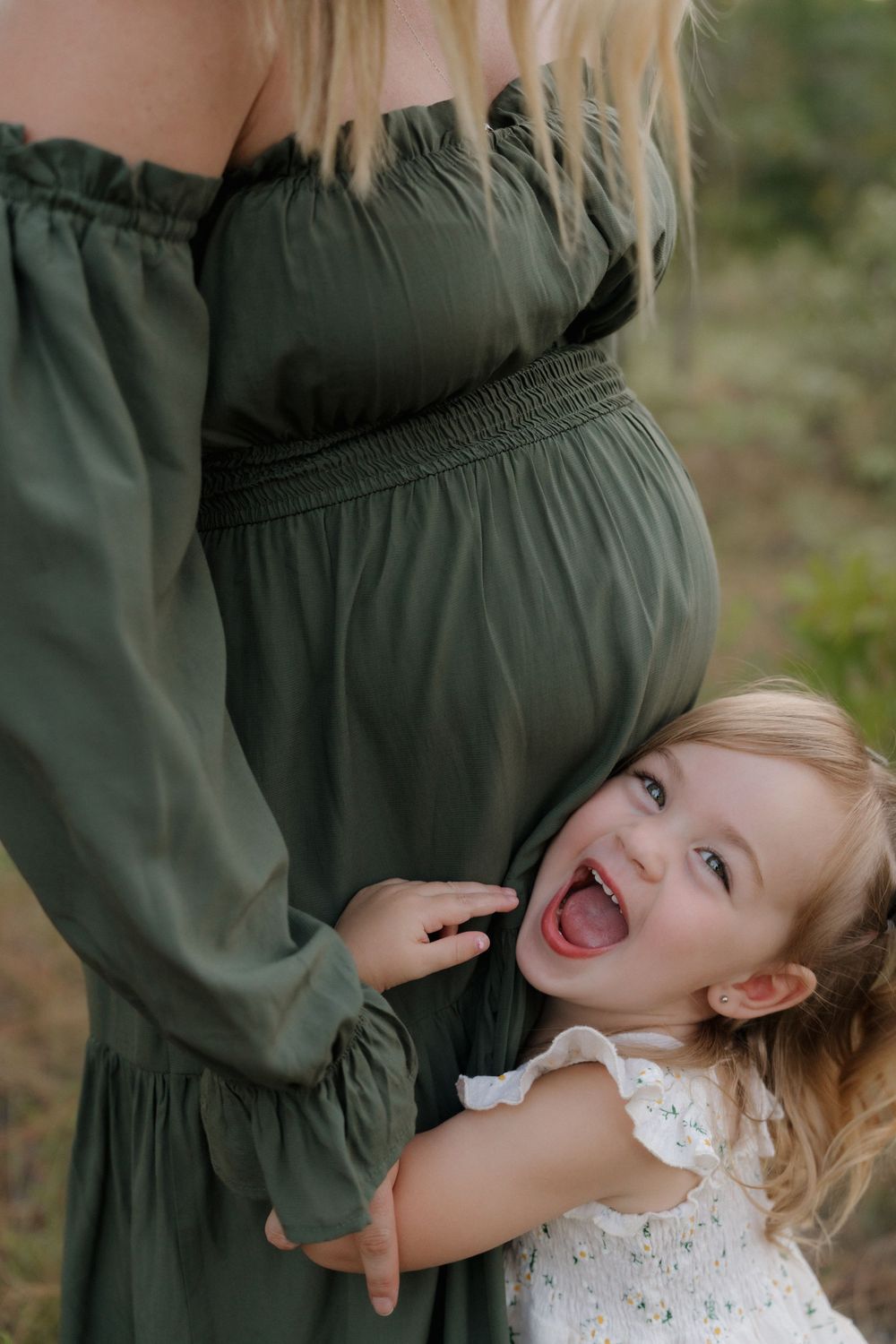Playful mother-child moment captured with joyful expressions and laughter.