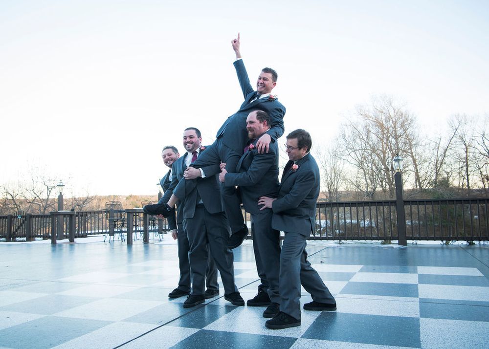 A sequence of five photos showing people in formal attire performing dance moves on a reflective floor outdoors.