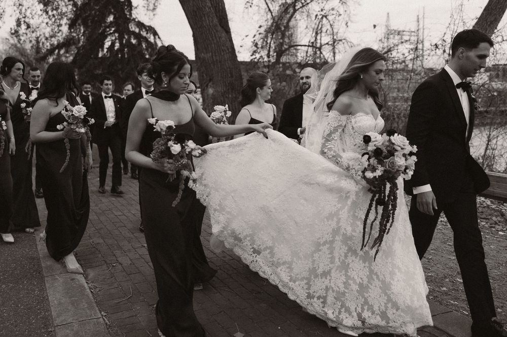 A series of black and white wedding photos showing couples dancing and celebrating at a reception.