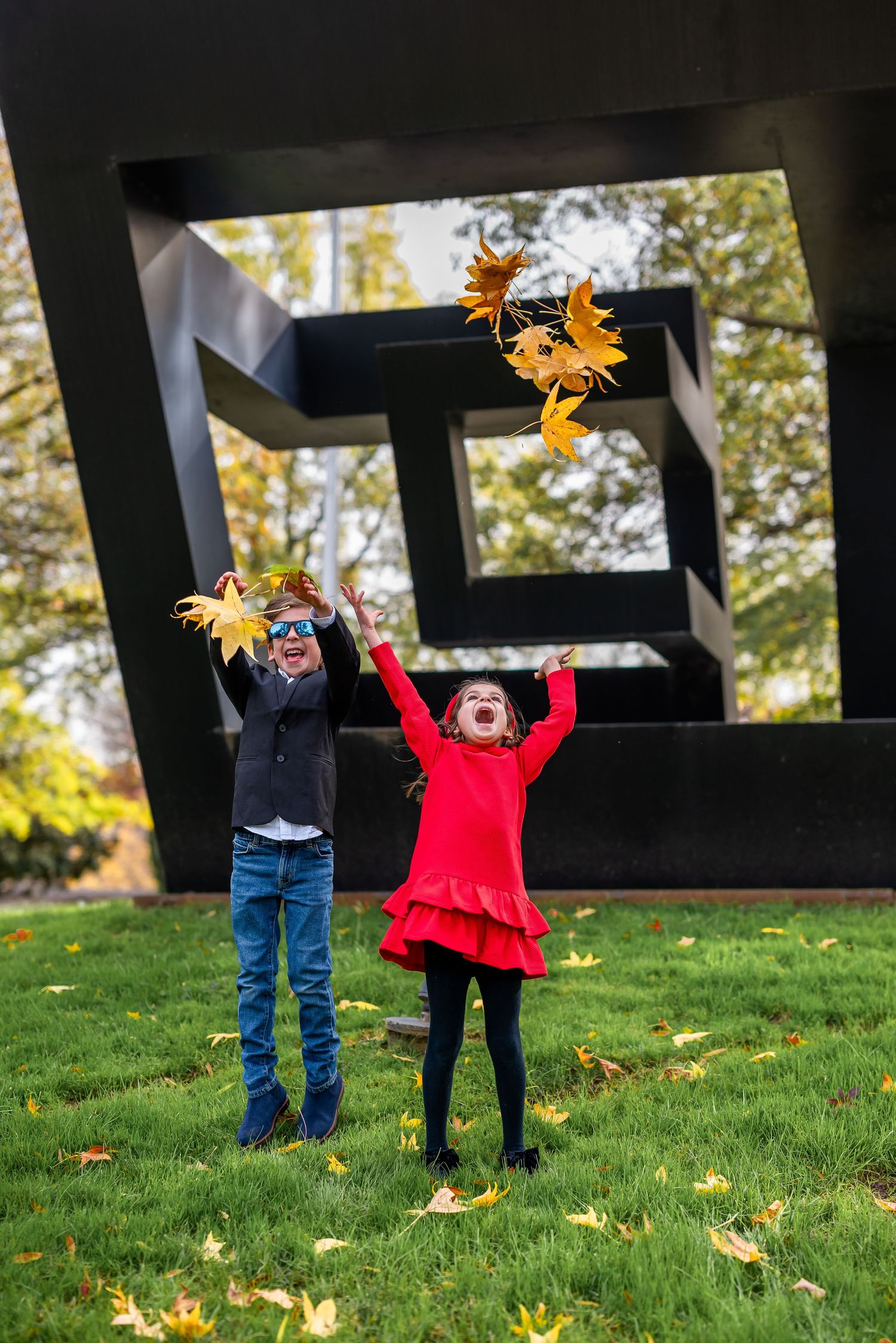 Elegant family photo session at the Kennedy Center in Washington, D.C., featuring stunning indoor chandeliers, panoramic