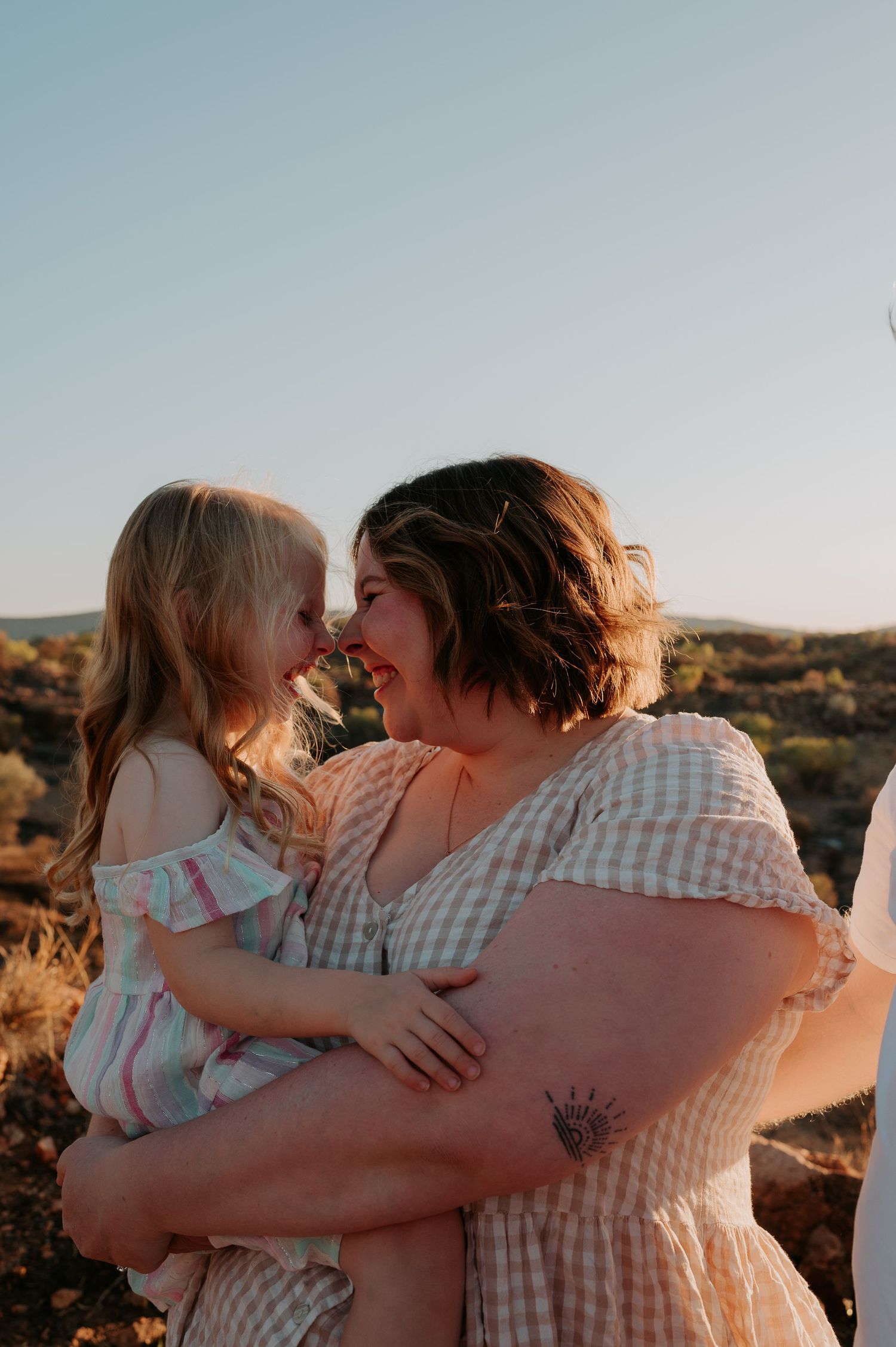 Mother and daughter give eskimo kisses - Alice Springs